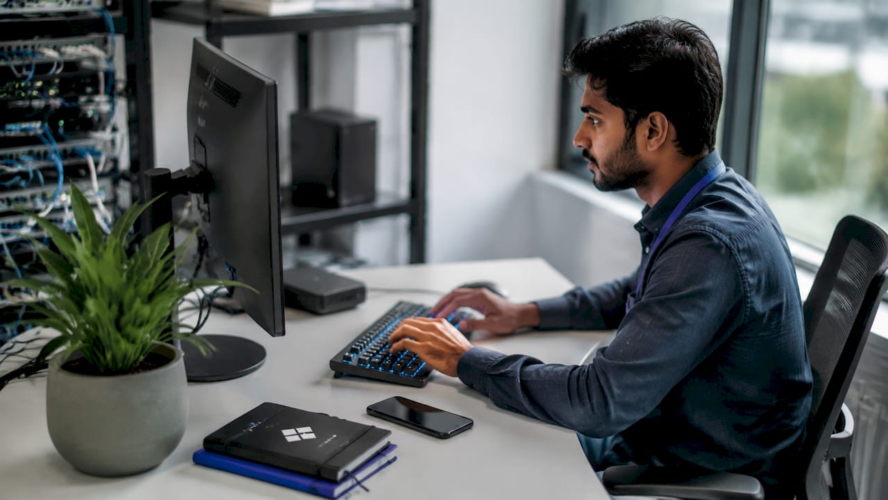 IT technician performing password reset automation