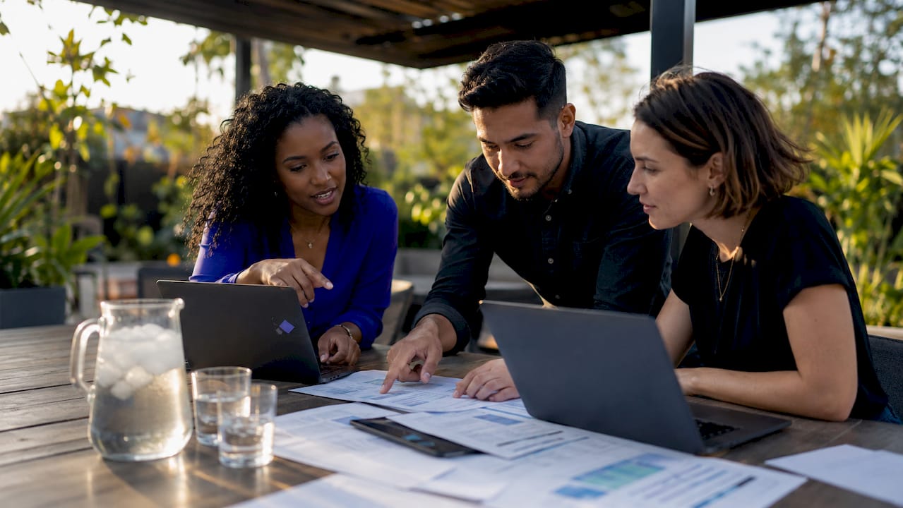 IT team collaborating on network data unification