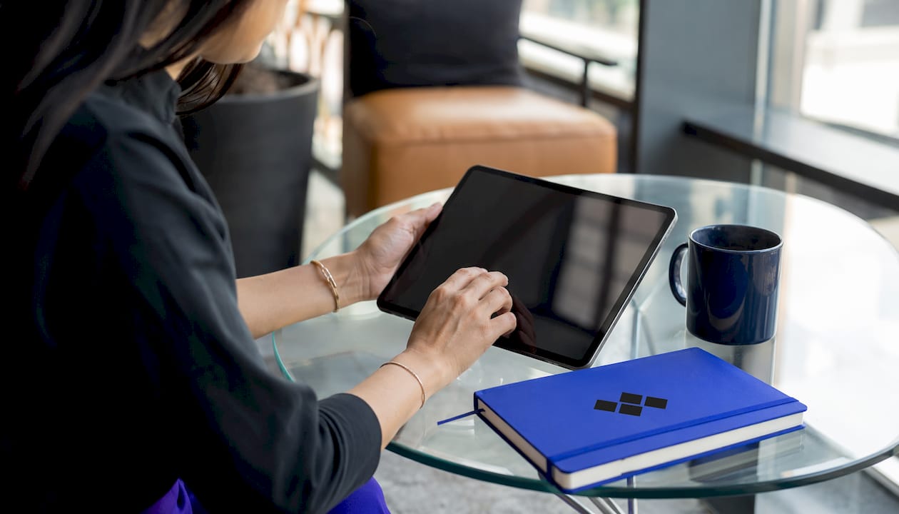 Hands customizing event registration form on tablet