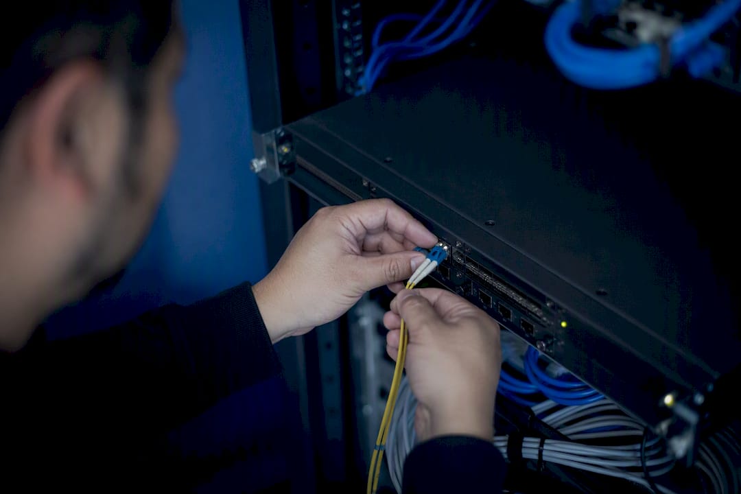 Hands inspecting and managing network poller cables