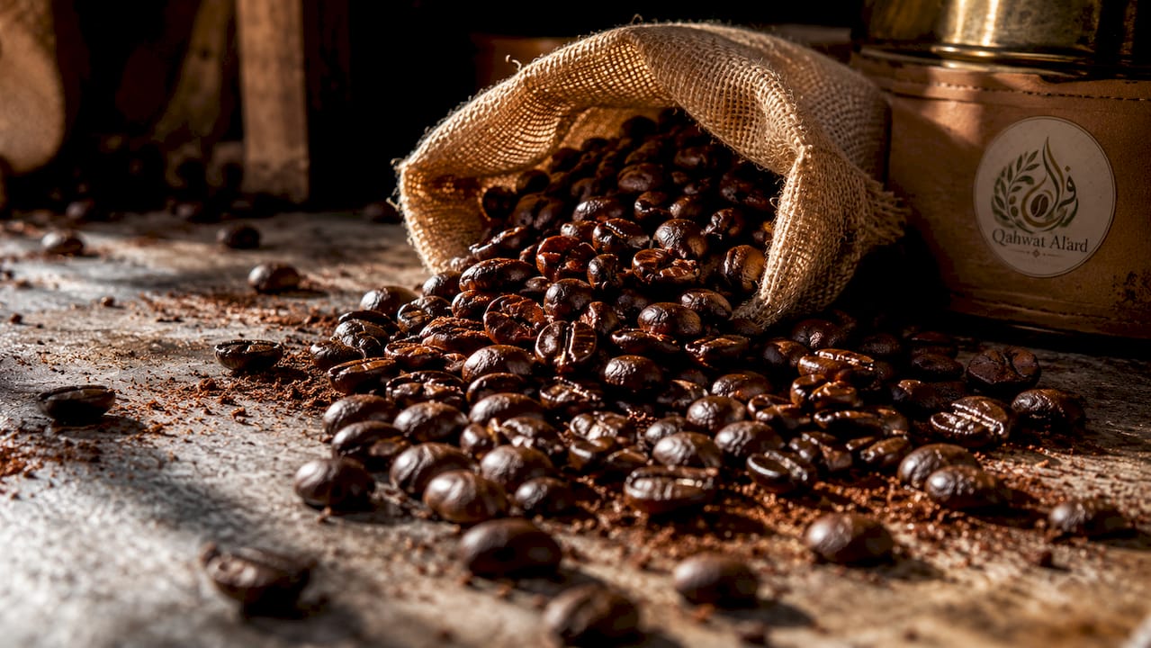 Close-up shiny oily coffee beans on rustic table