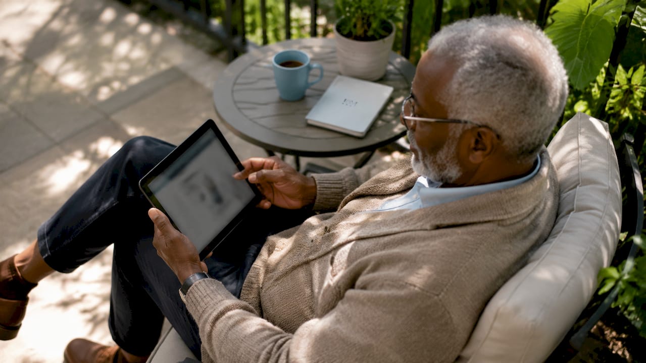 Elderly man using healthcare website on tablet