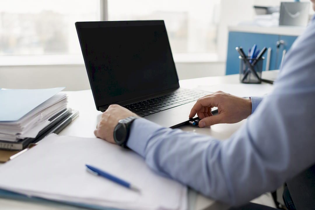 Hands connecting booking data to EMR system