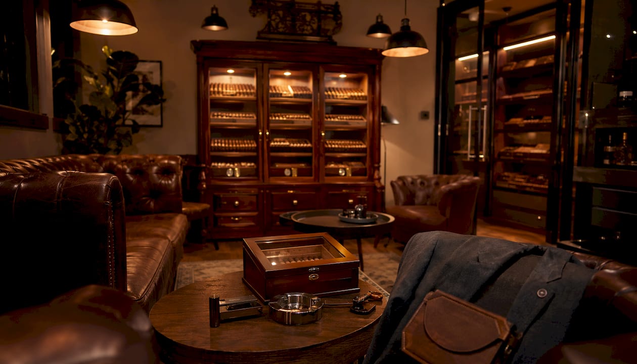 Collector lounge showing walk-in, cabinet, and desktop humidors