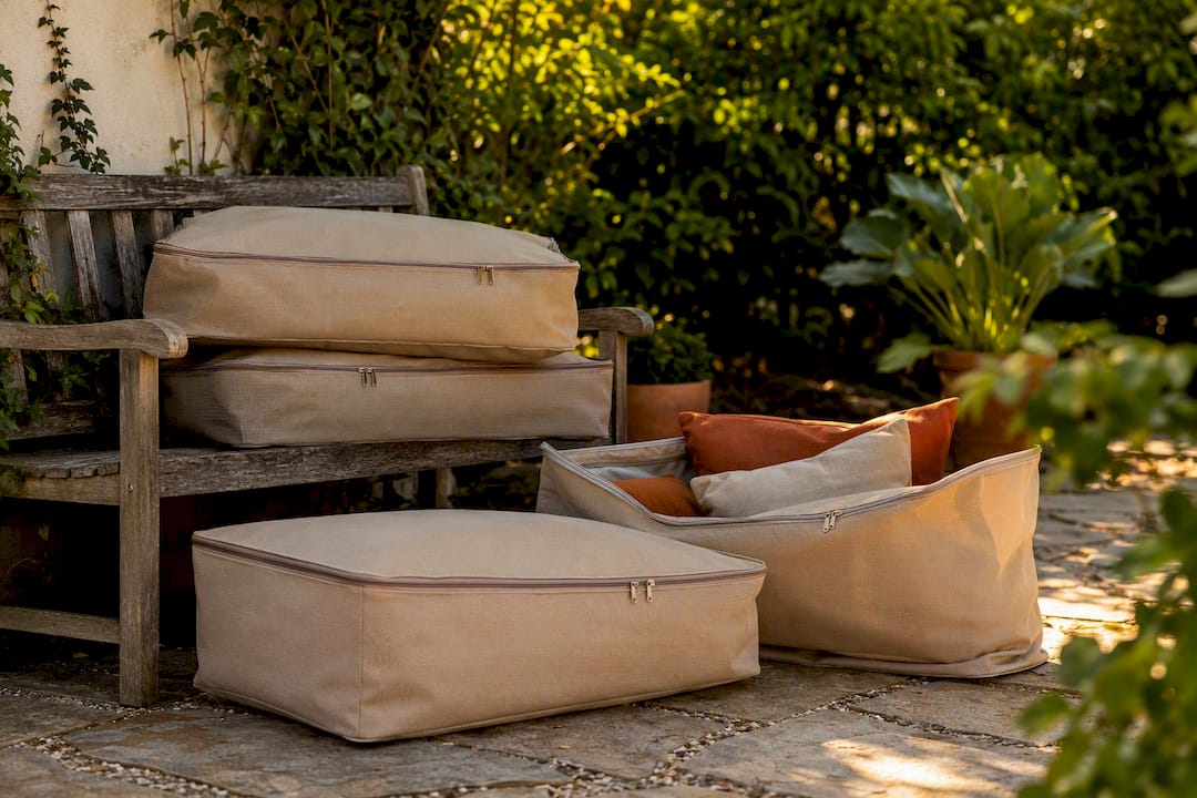 Outdoor breathable storage bags with cushions in shed corner