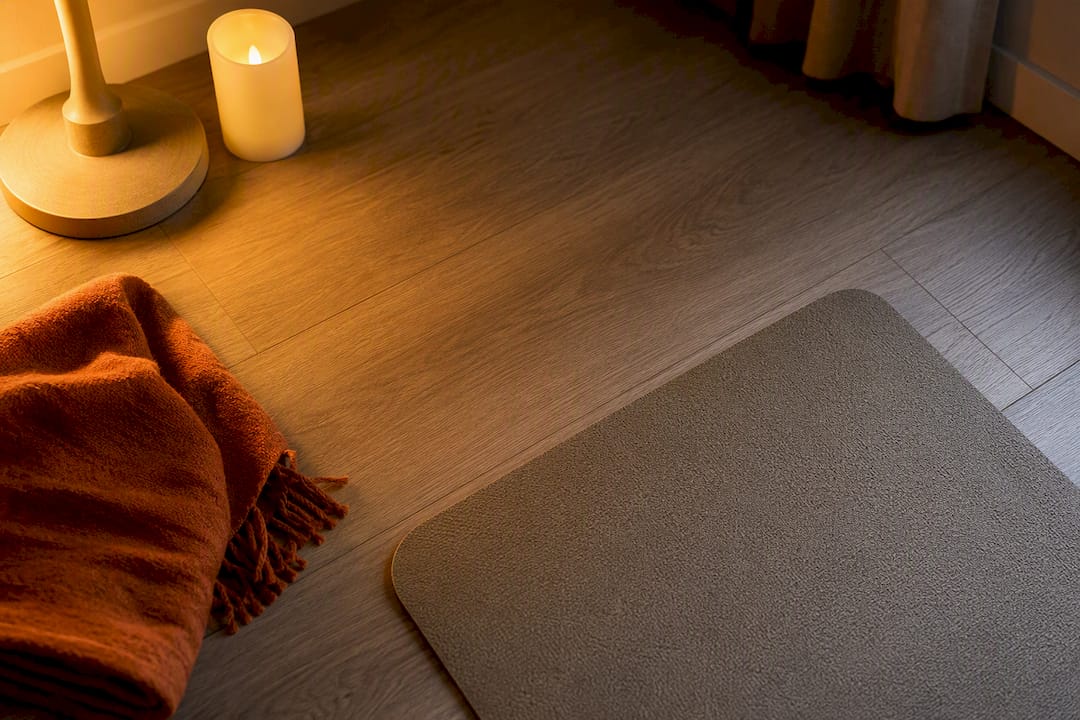 Warm lamp and candle lighting a yoga corner