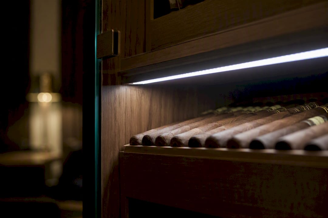 LED strip lighting behind cigar display glass