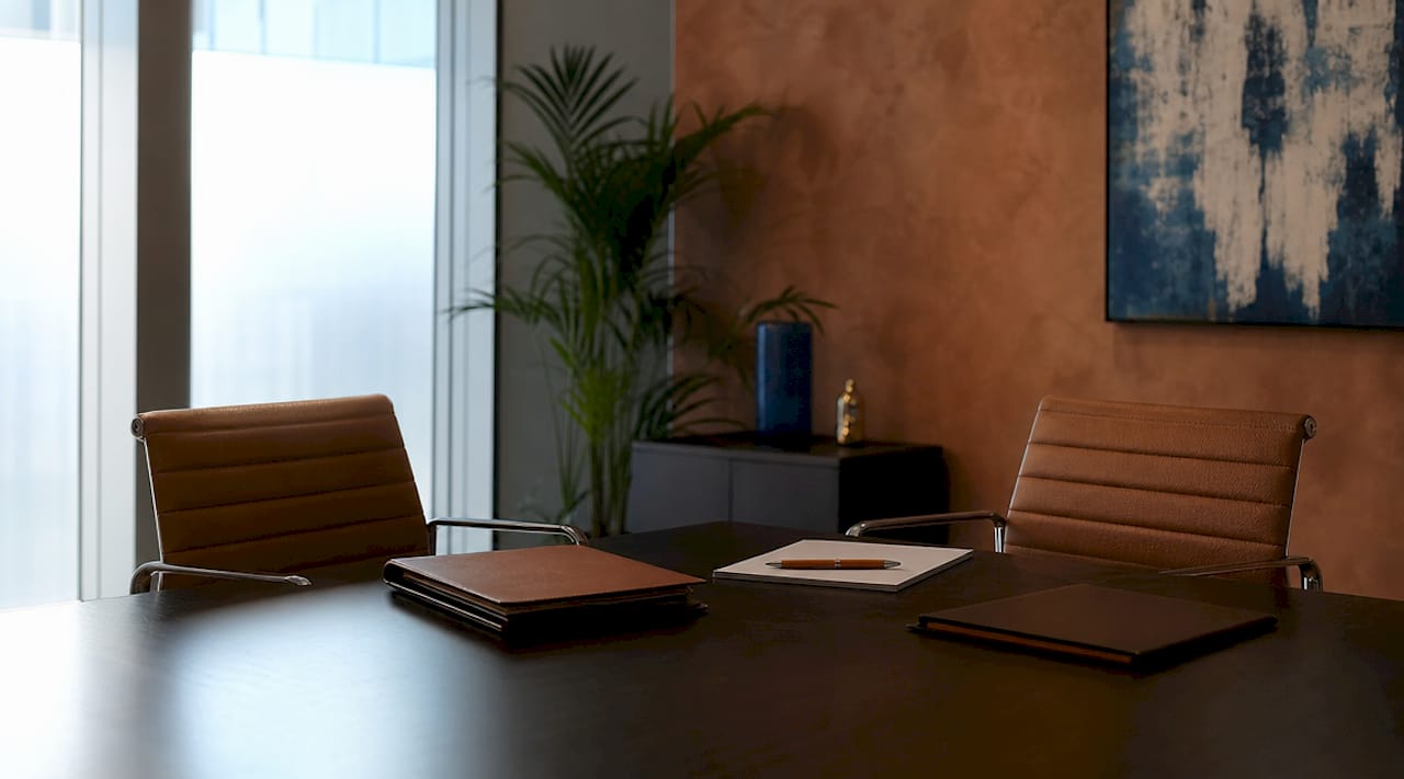 Israeli Class Action Lawsuit: What You Need to Know 2 Attorneys discussing class action lawsuit notes