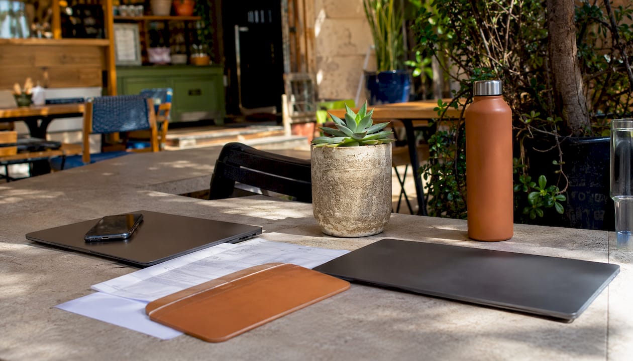 Coworking space with business tools and Israeli flag
