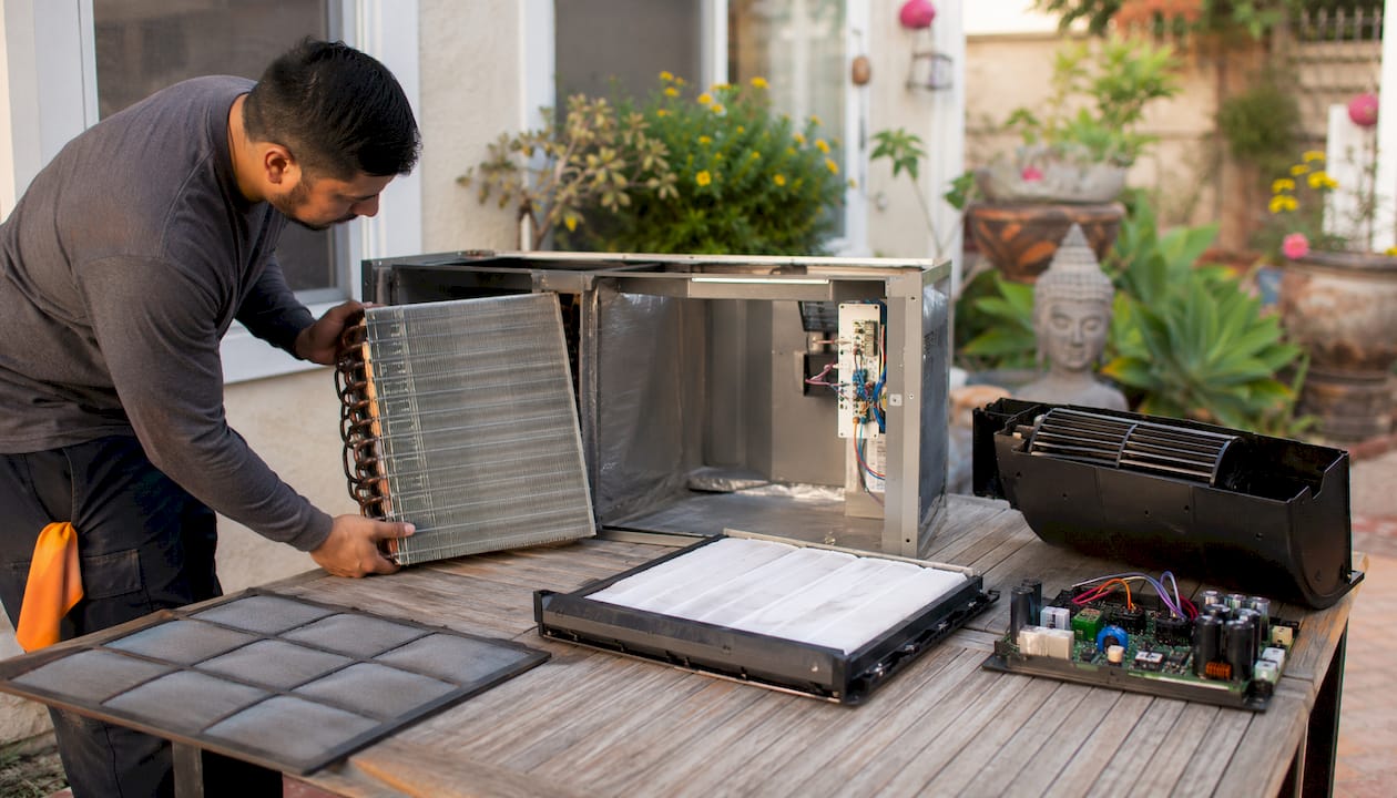 Disassembled air handler components on bench