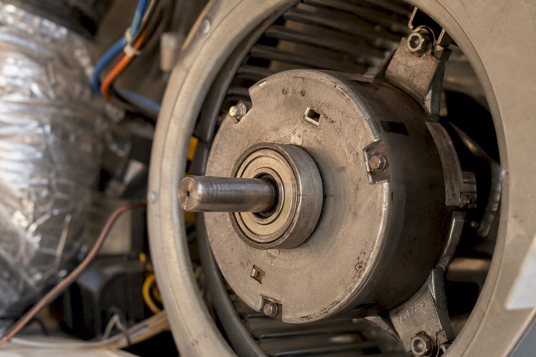 Blower motor and bearing close-up inside AC unit
