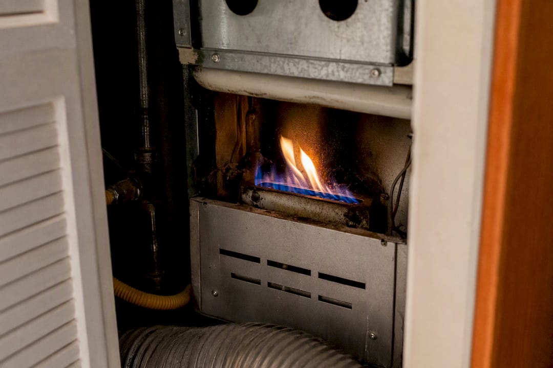 Furnace burner with yellow flame and soot