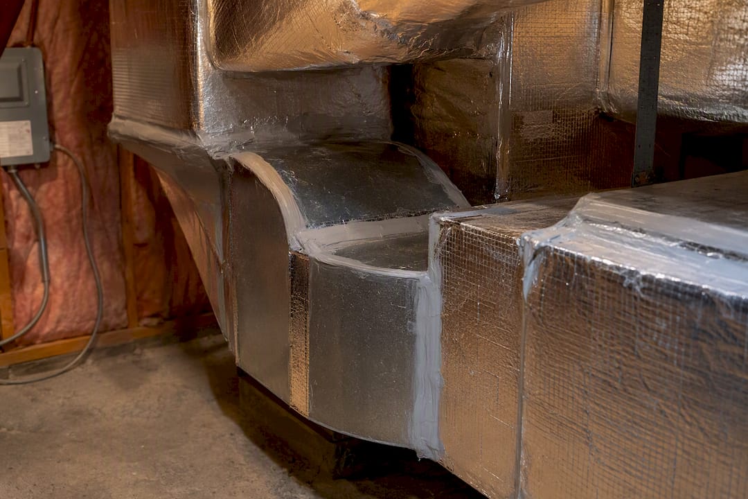 Sealed ductwork joints in home HVAC utility closet