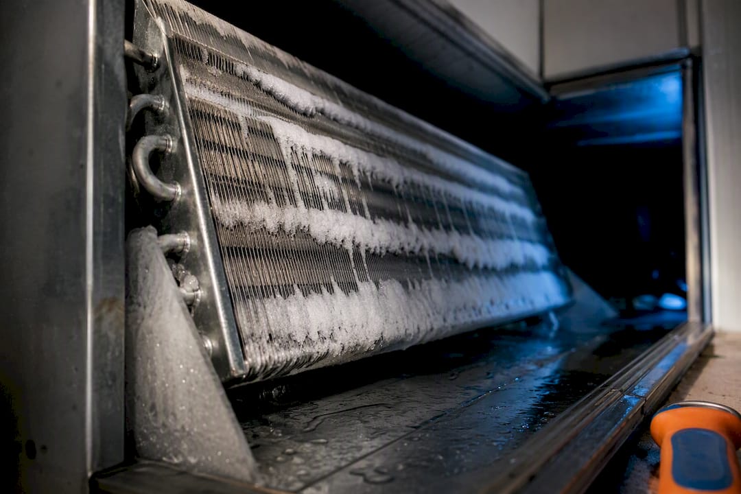 Ice forming across an evaporator coil