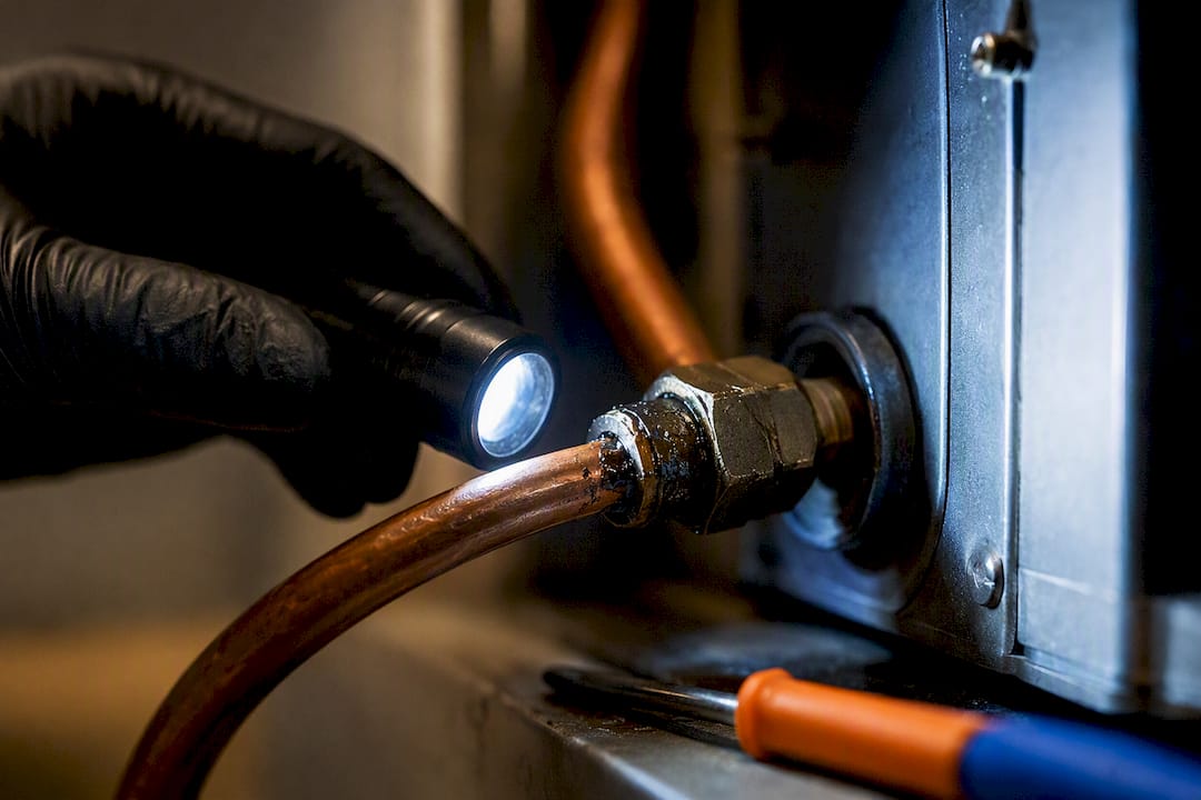 Oily residue around copper refrigerant line