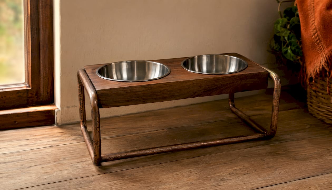 Minimalist illustration of metal and wood pet feeder design