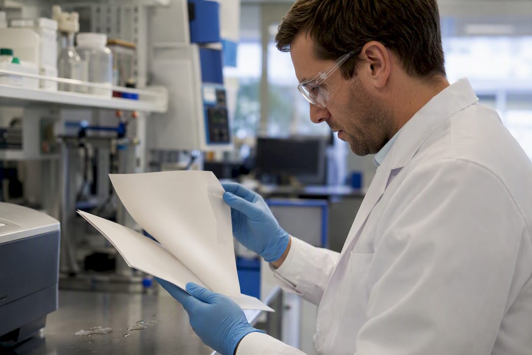 Scientist checking peptide certificate of analysis