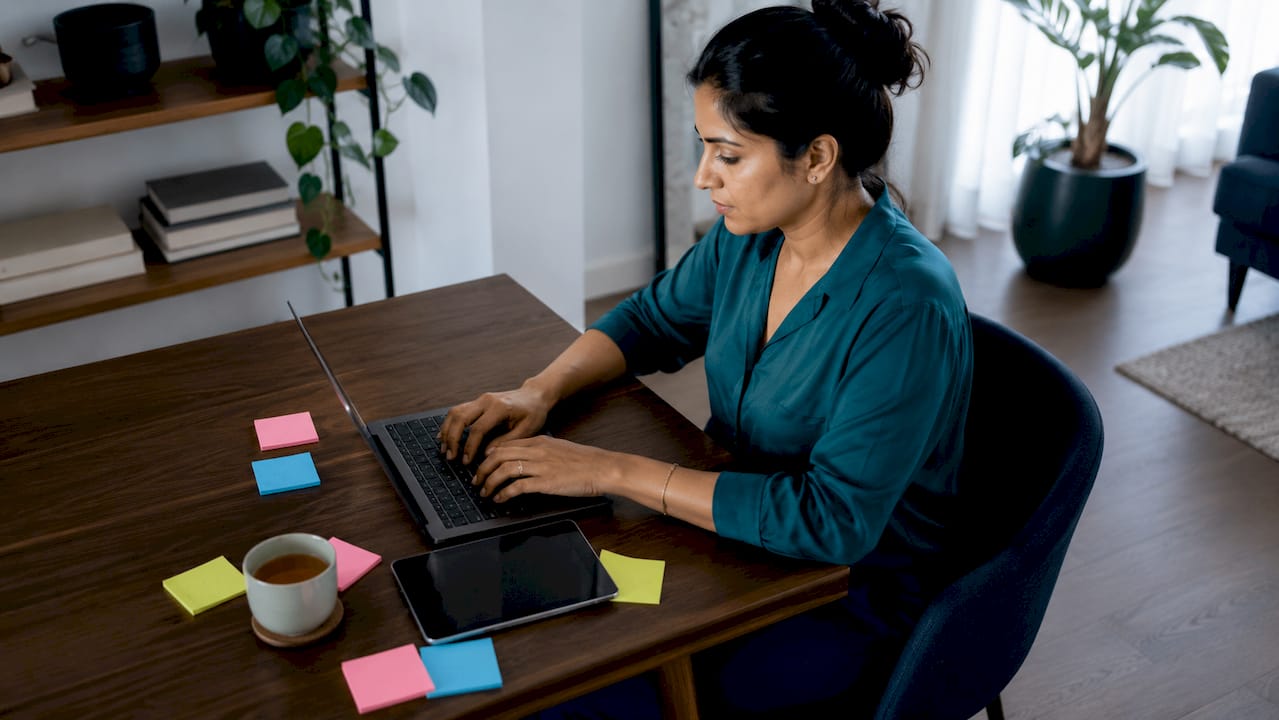 Woman working on AI digital transformation at desk