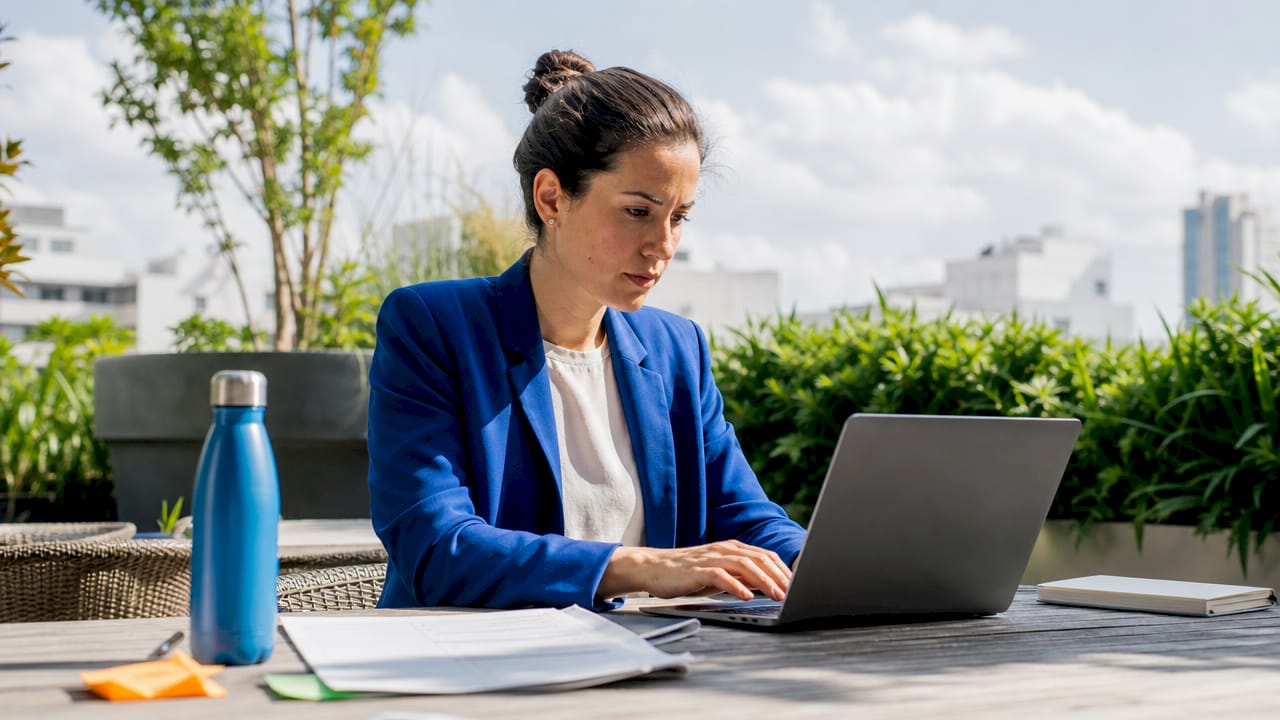 Woman deploying marketing chatbot on laptop
