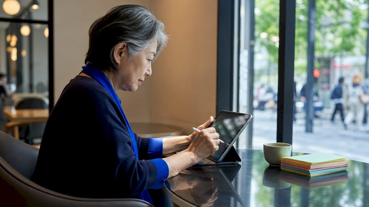 Professional woman using AI conversational robot on tablet