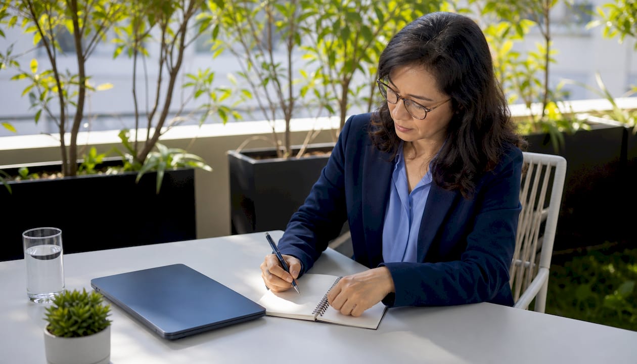 Businesswoman reviewing AI strategy in boardroom