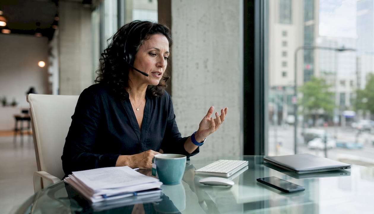 Business owner using chatbot to reduce support costs