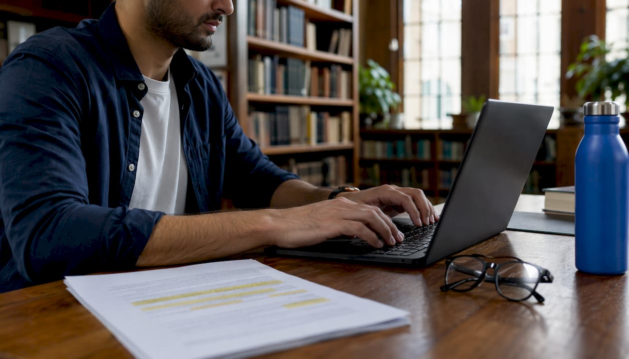 Close-up hands typing next to AI transparency reports