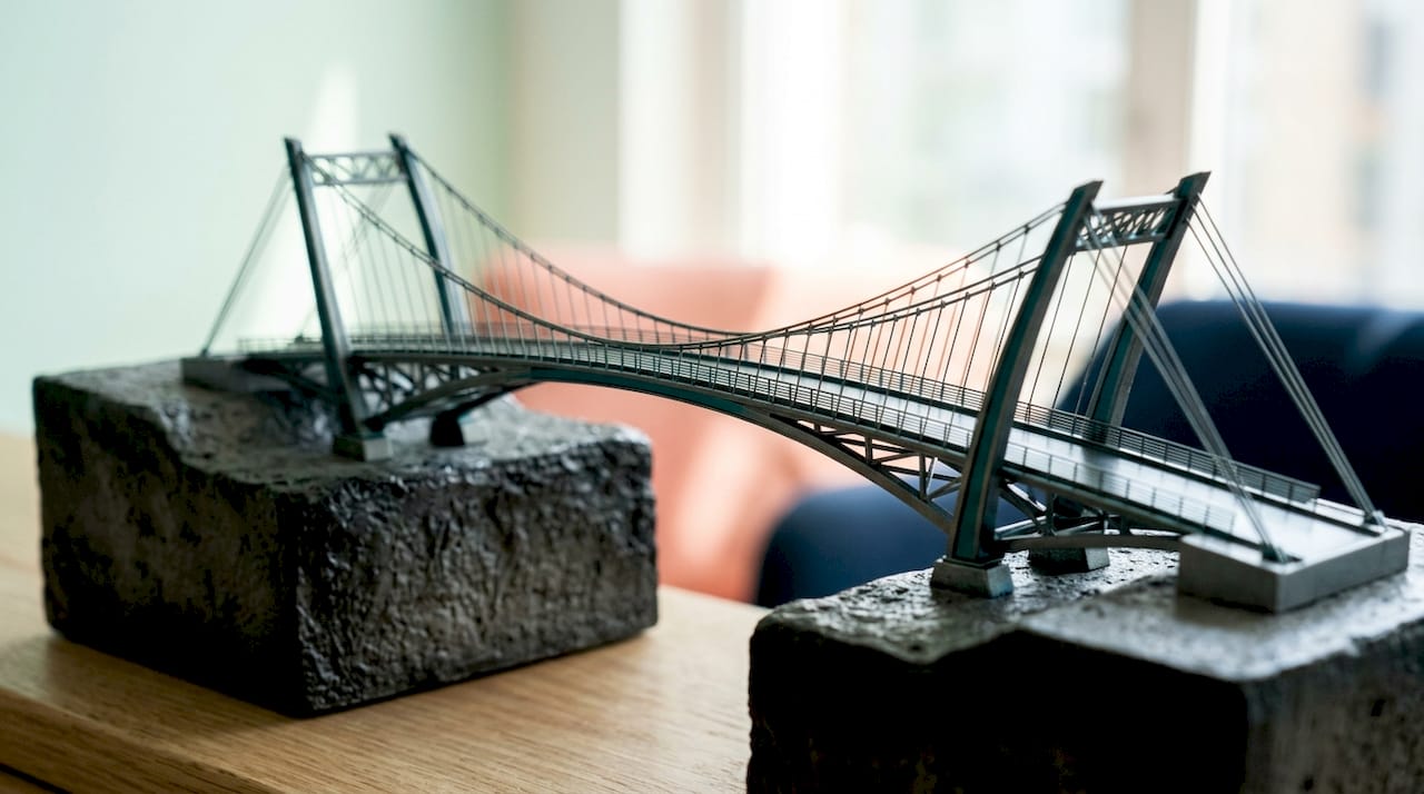 Close-up of modern bridge model symbolizing career transition