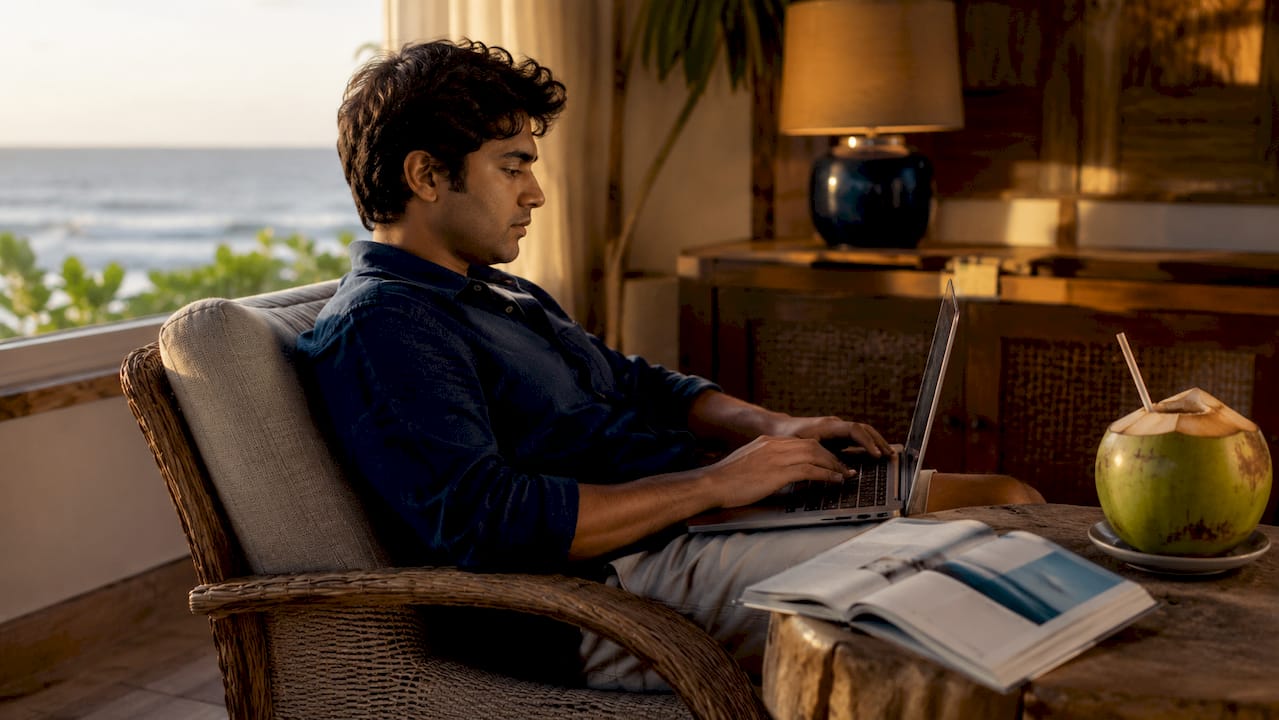 Man researching group vacation rentals on laptop at home