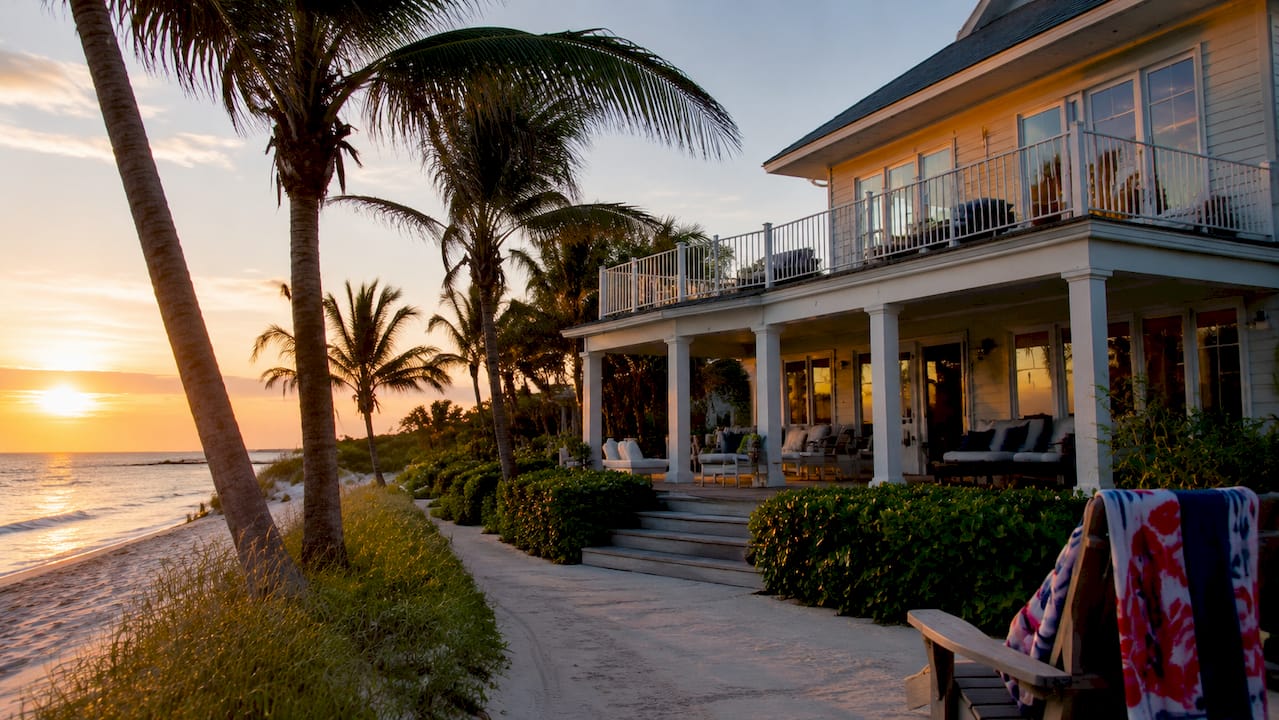 Beachfront home exterior beside sandy beach