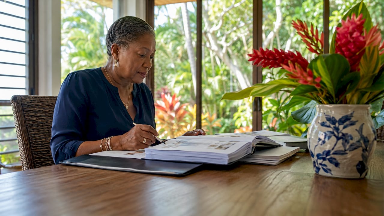 Travel consultant reviewing luxury rental vetting documents