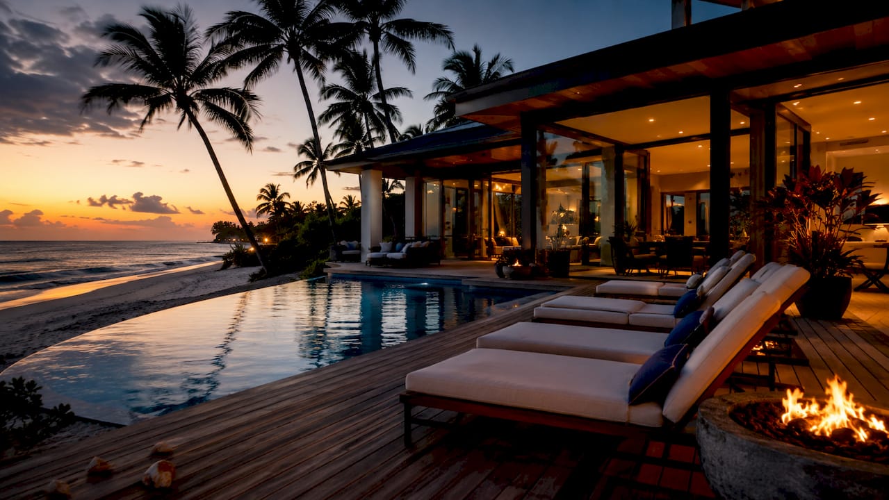 Modern luxury beach house exterior at sunset