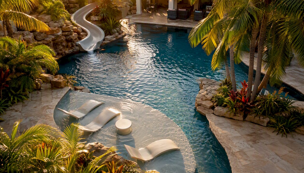 Saltwater private pool with slide and tanning ledge