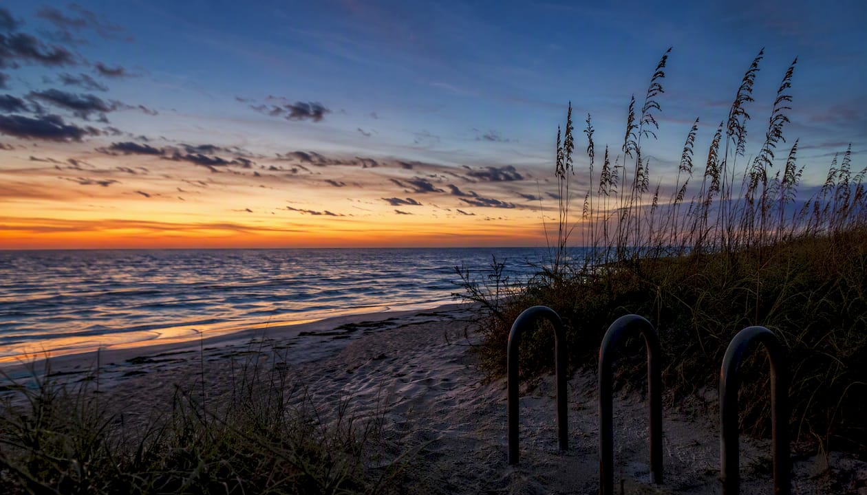 Sunset over sandy dunes and Gulf at Andy Rosse Lane