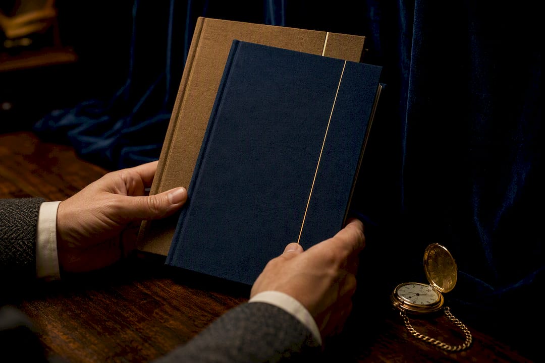 Hands with economic reports on desk
