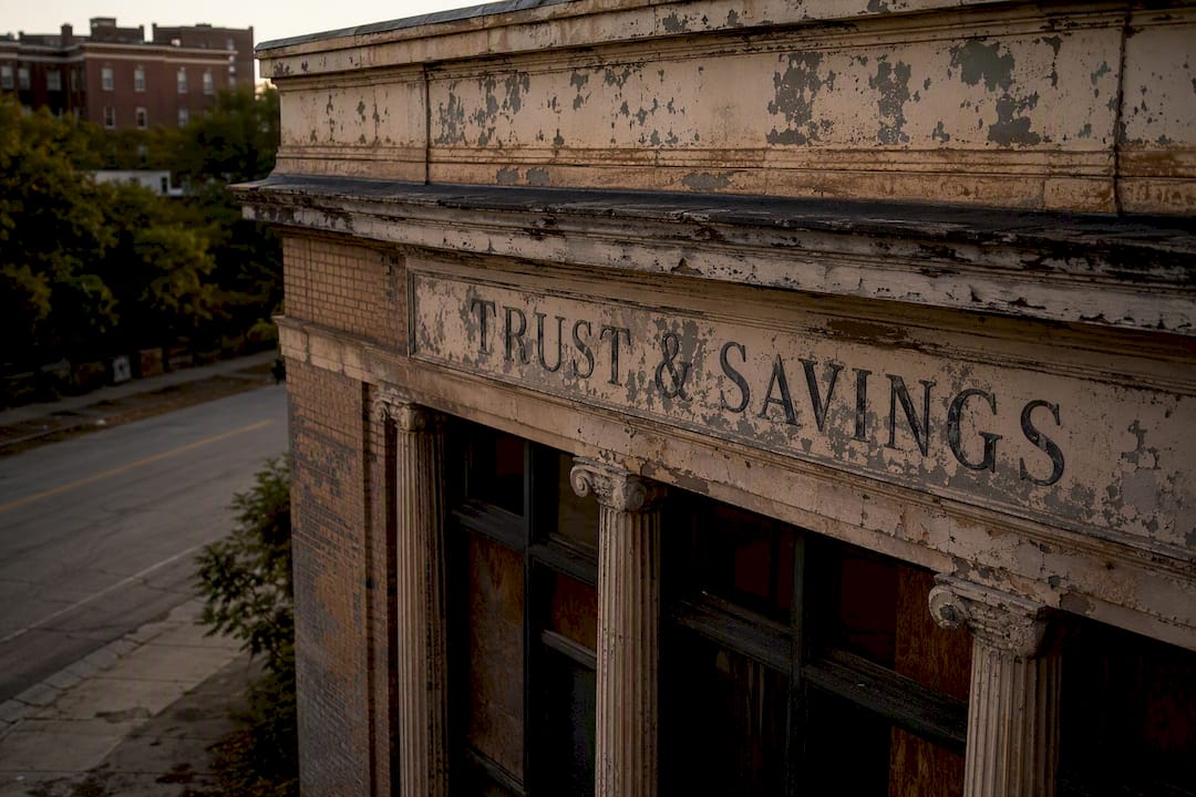 Faded Savings and Loan sign on old building