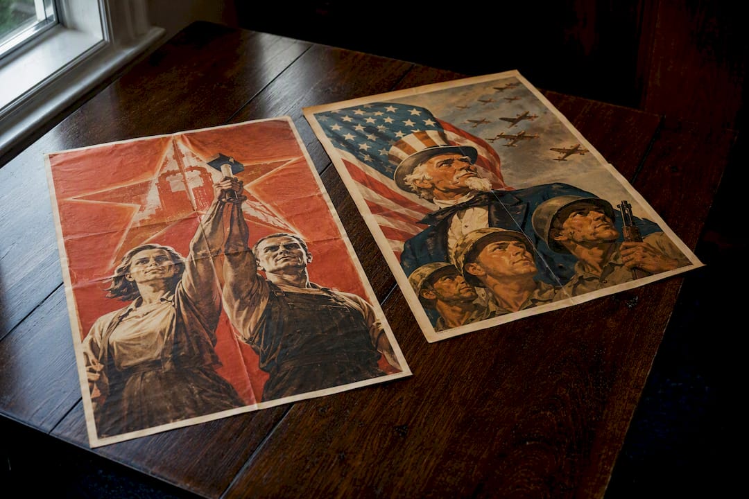Side-by-side Soviet and American propaganda posters