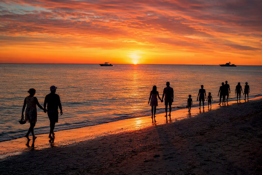 Sunset walkers on Captiva village beach