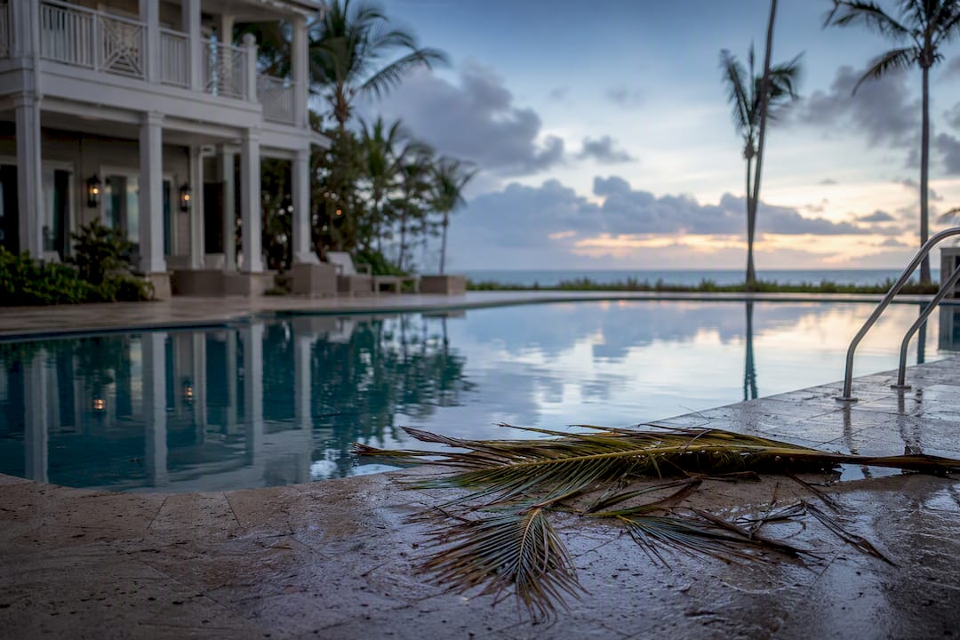 Beachfront pool area recovering after storm