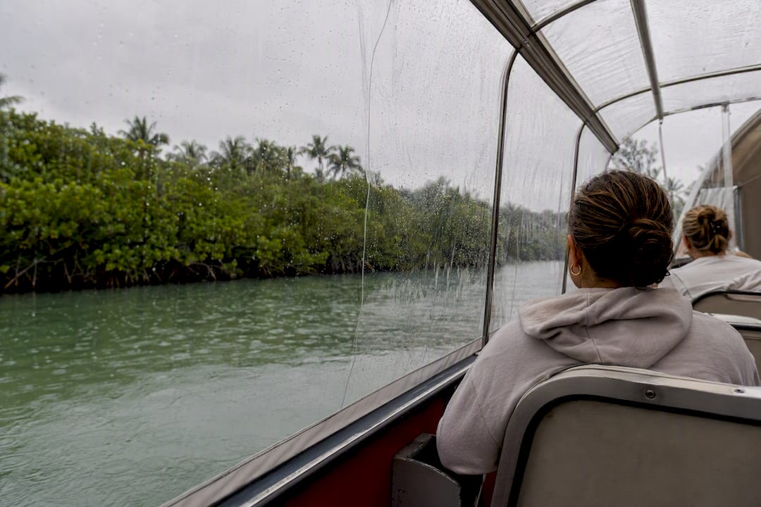 Covered boat tour cruising in rain near Captiva Island