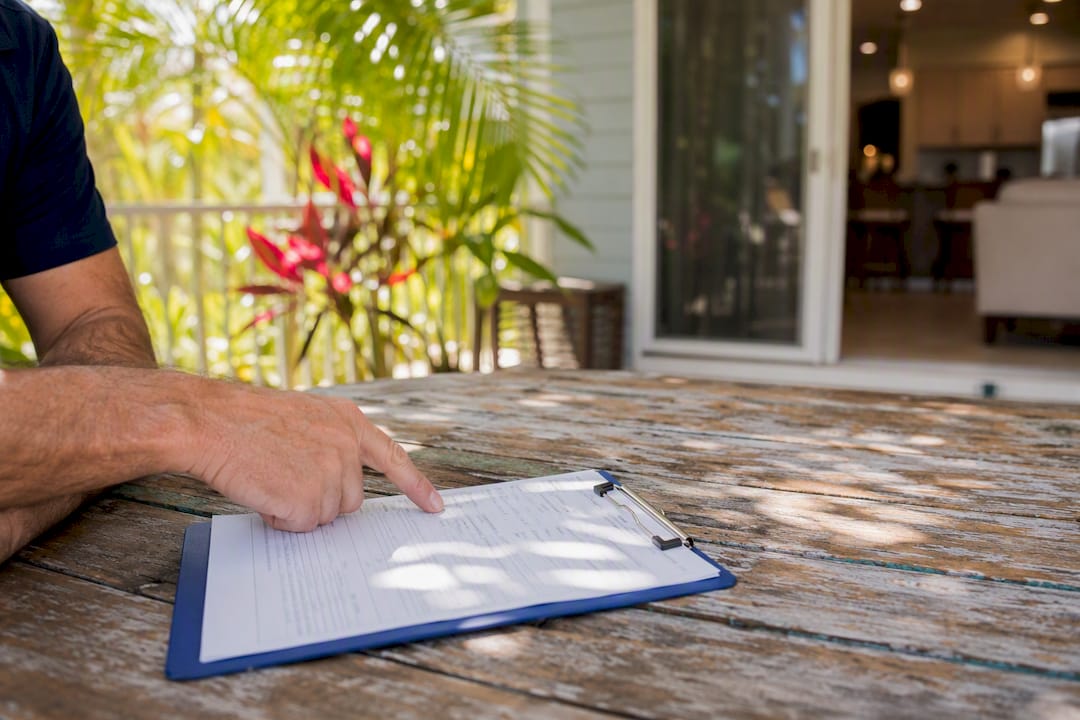 Damage report checklist on Florida rental porch table