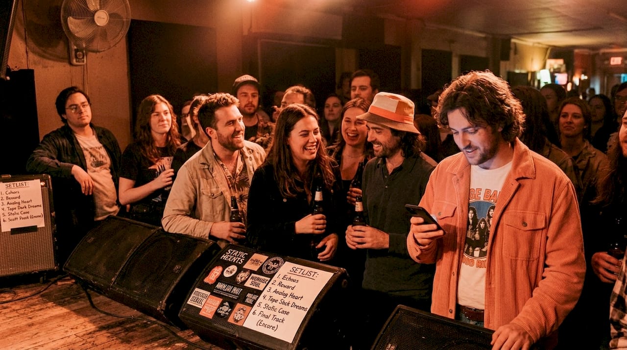 Crowd in small music venue near stage