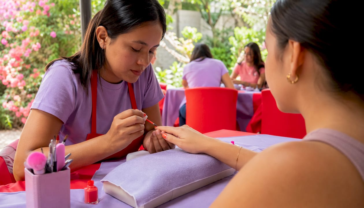 Nail technician applying polish in calm salon