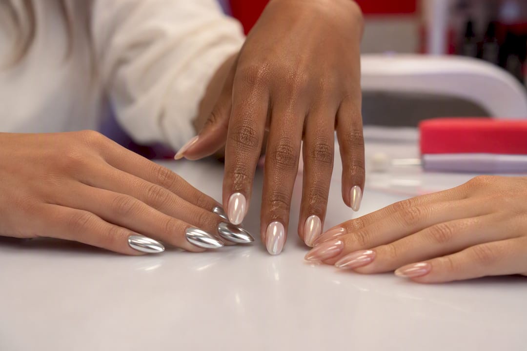 Three hands showing mirror, pearl, glass chrome nails