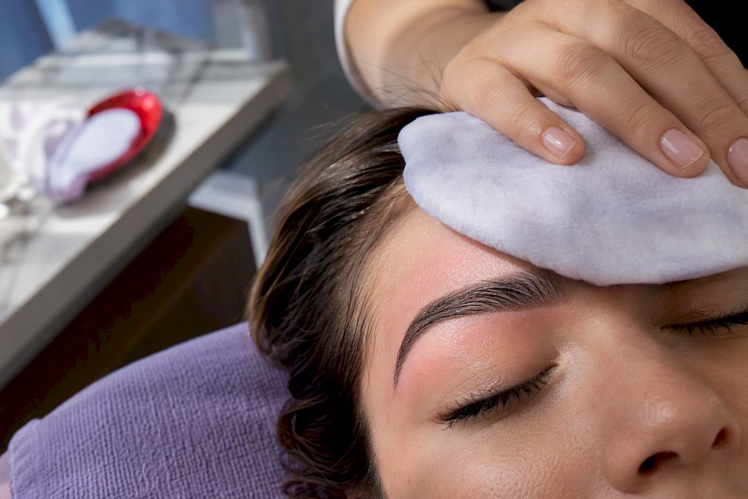 Freshly waxed eyebrow under cool compress