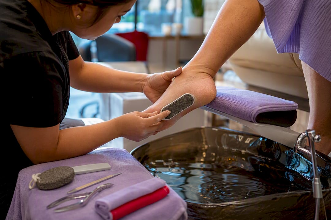 Professional pedicure smoothing cracked heel