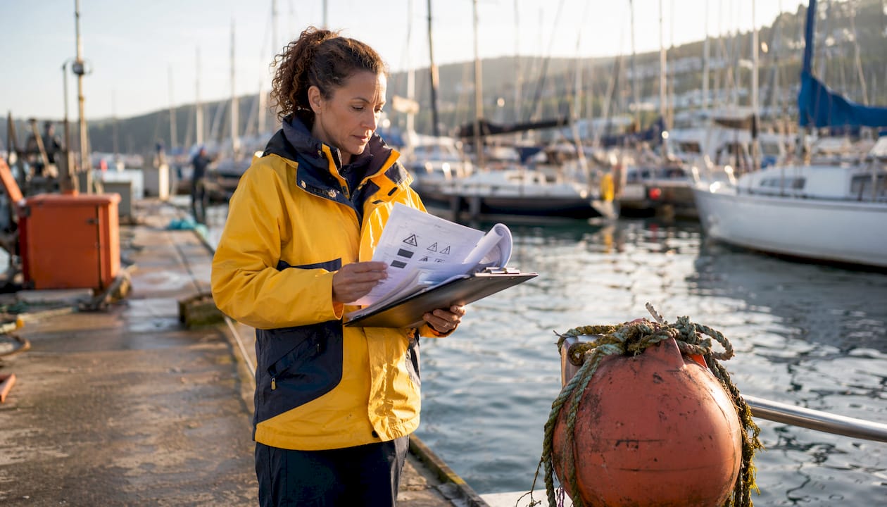 Marina safety officer reviewing safety signage rules