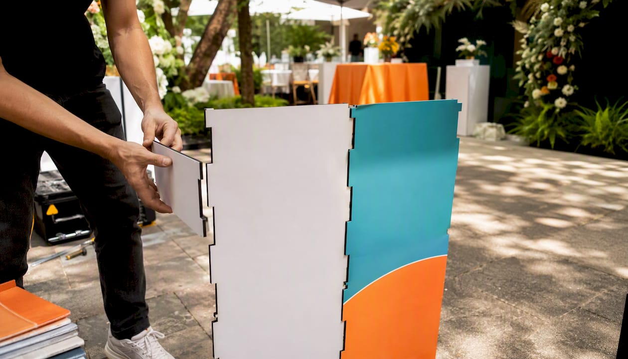 Hands assembling modular exhibition stand panels