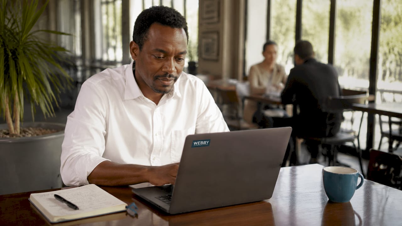 Man checking Google Business listing on laptop