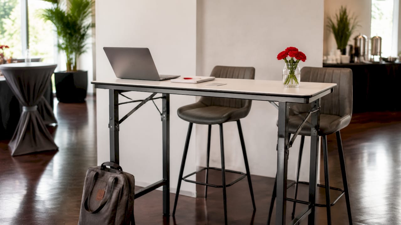 Modular table and bar stools in empty booth